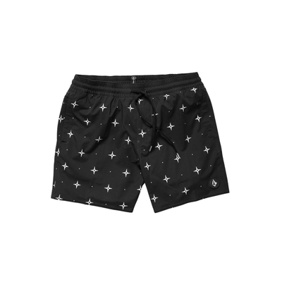 Man wearing black volcom lido swim shorts with star pattern on a white background