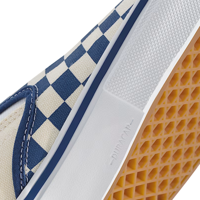 Close-up of a Vans Checkered skate slip-on shoe with blue and white pattern on a white background