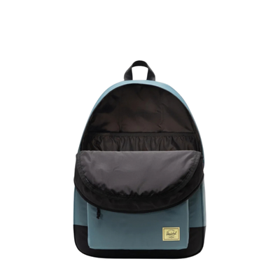 open blue herschel classic xl backpack on a white background