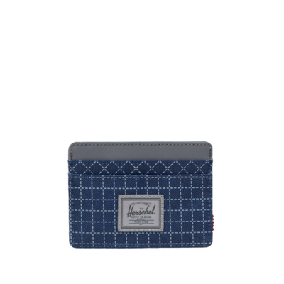 blue herschel charlie card wallet with grid pattern on a white background