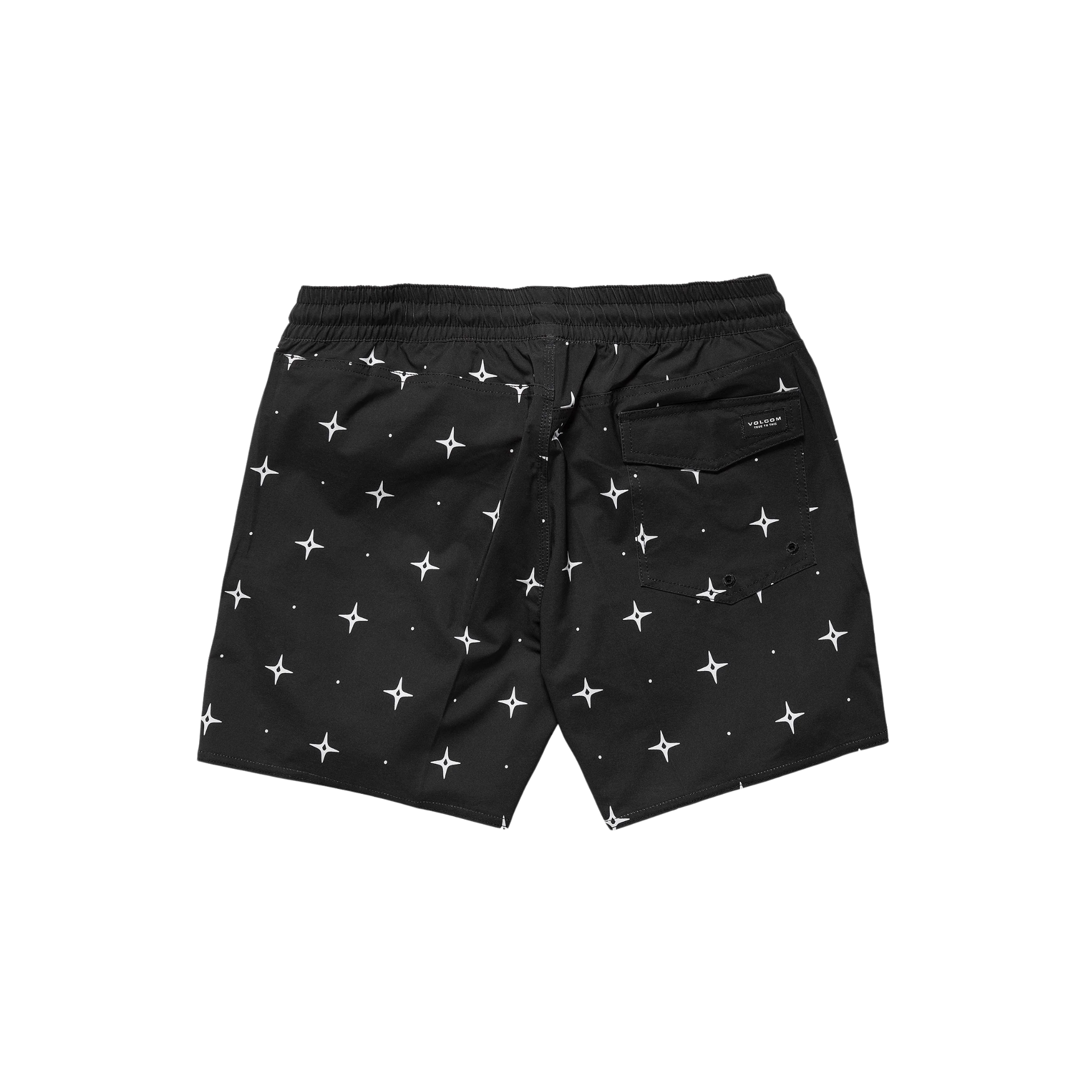 Man wearing black volcom lido swim shorts with star pattern on a white background