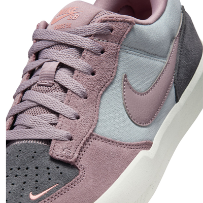 Multicolor NIKE SB women's force 58 sneaker with a pink swoosh on a white background