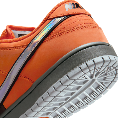 Orange and brown nike sb dunk low pro muni fast pass sneaker with a colorful swoosh logo on a white background