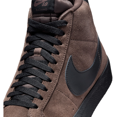 Brown mid-top nike sb blazer sneaker with black swoosh logo on a white background