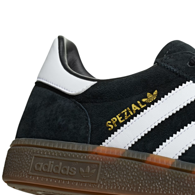 Black Adidas HANDBALL SPEZIAL sneaker with white stripes on a white background