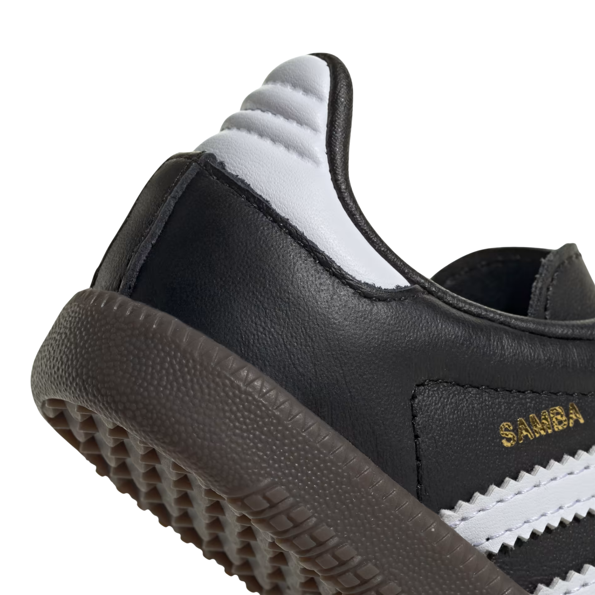 close up of A single Adidas Samba kids sneaker in black leather with signature white side stripes, a gold 'SAMBA' text on the side, and a dark brown gum sole, shown against a plain white background.