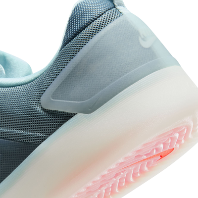 Blue nike sb zoom nyjah 4 skateboard sneaker with a white sole on a white background