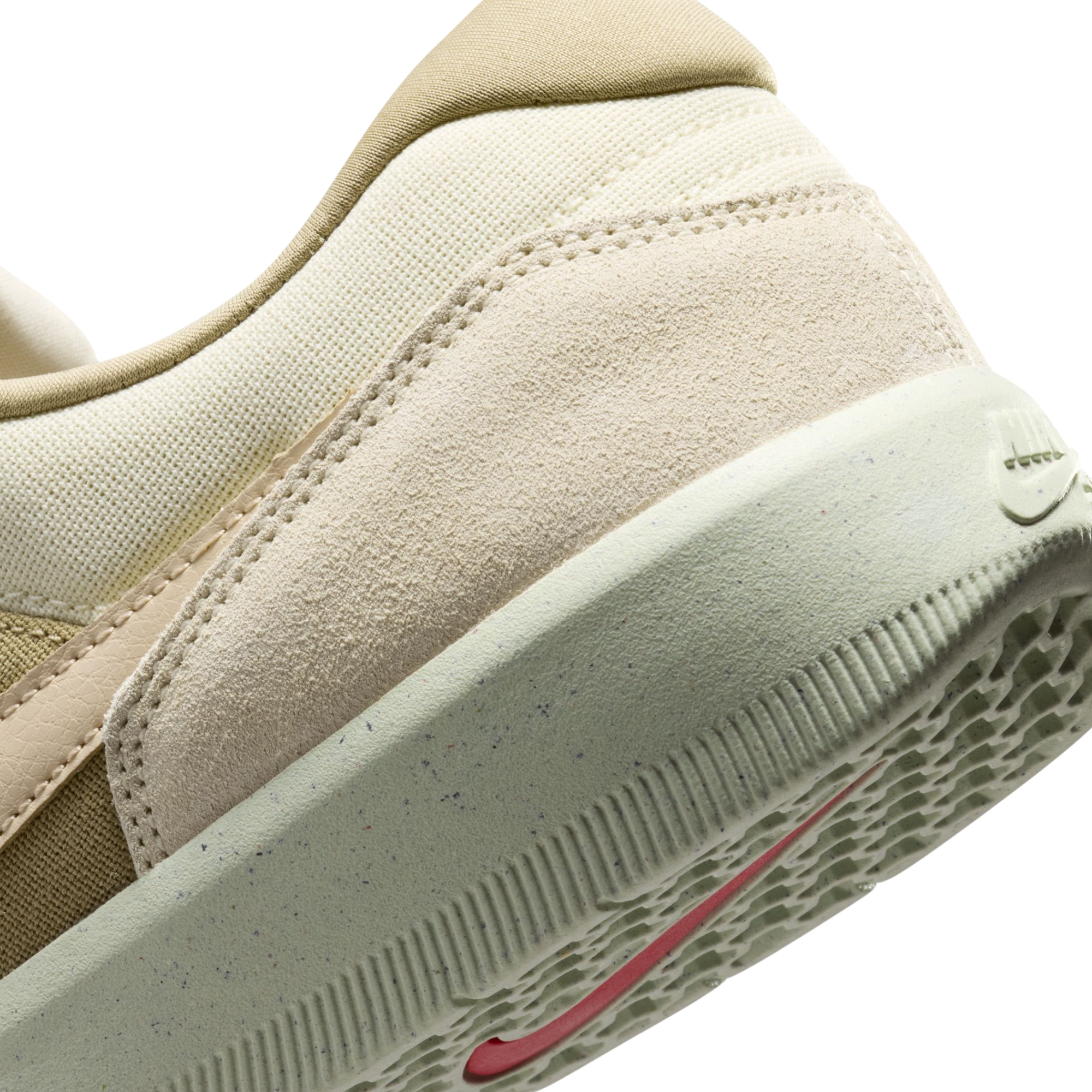 Beige nike sb force 58 sneaker with a brown accent on a white background