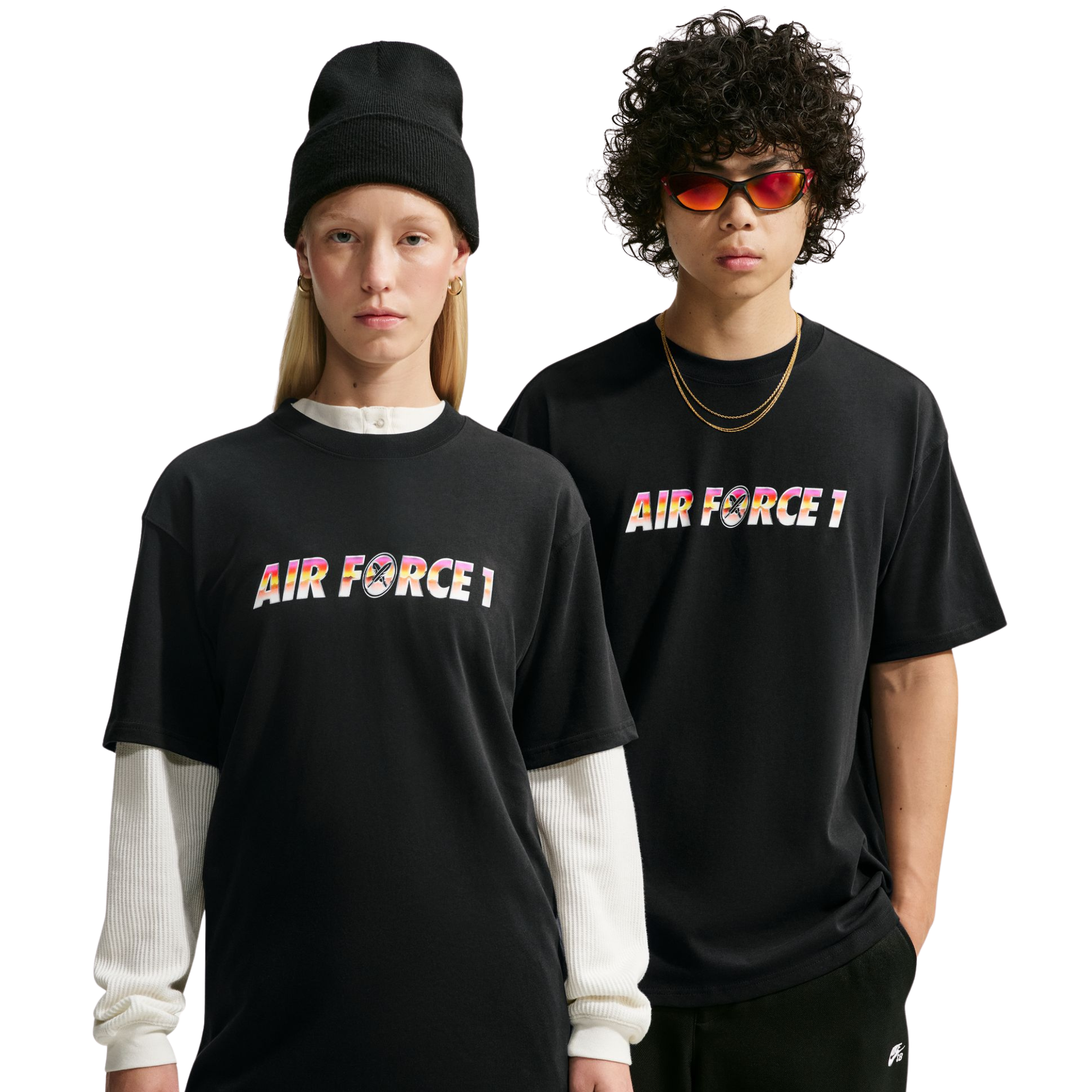 Two models wearing nike sb yuto horigome black t-shirt with 'AIR FORCE 1' printed across the chest in a colorful gradient pattern. The model on the left wears a black beanie and a white long-sleeve shirt underneath, while the model on the right wears red-tinted sunglasses and a gold necklace.