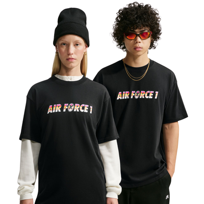 Two models wearing nike sb yuto horigome black t-shirt with 'AIR FORCE 1' printed across the chest in a colorful gradient pattern. The model on the left wears a black beanie and a white long-sleeve shirt underneath, while the model on the right wears red-tinted sunglasses and a gold necklace.