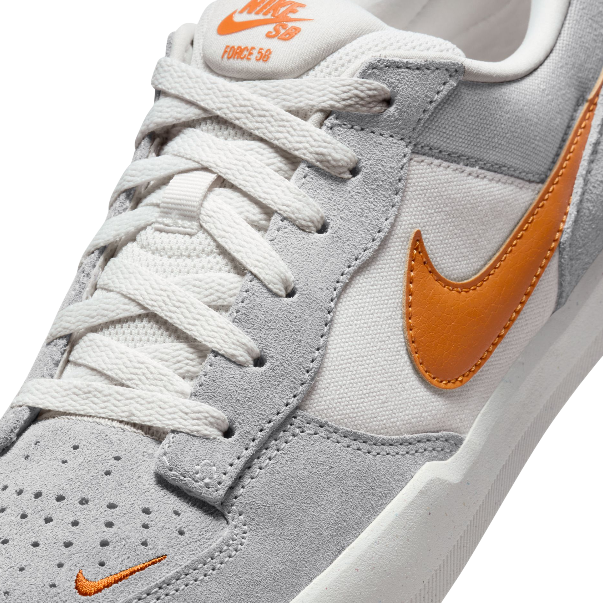 Gray NIKE SB men's force 58 sneaker with orange swoosh logo on a white background