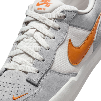 Gray NIKE SB men's force 58 sneaker with orange swoosh logo on a white background