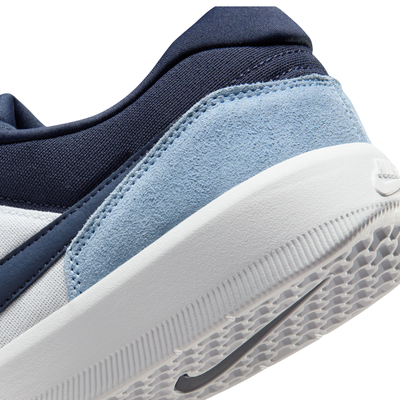 Navy and light blue NIKE SB FORCE 58 men's and women's sneaker with a white sole on a white background
