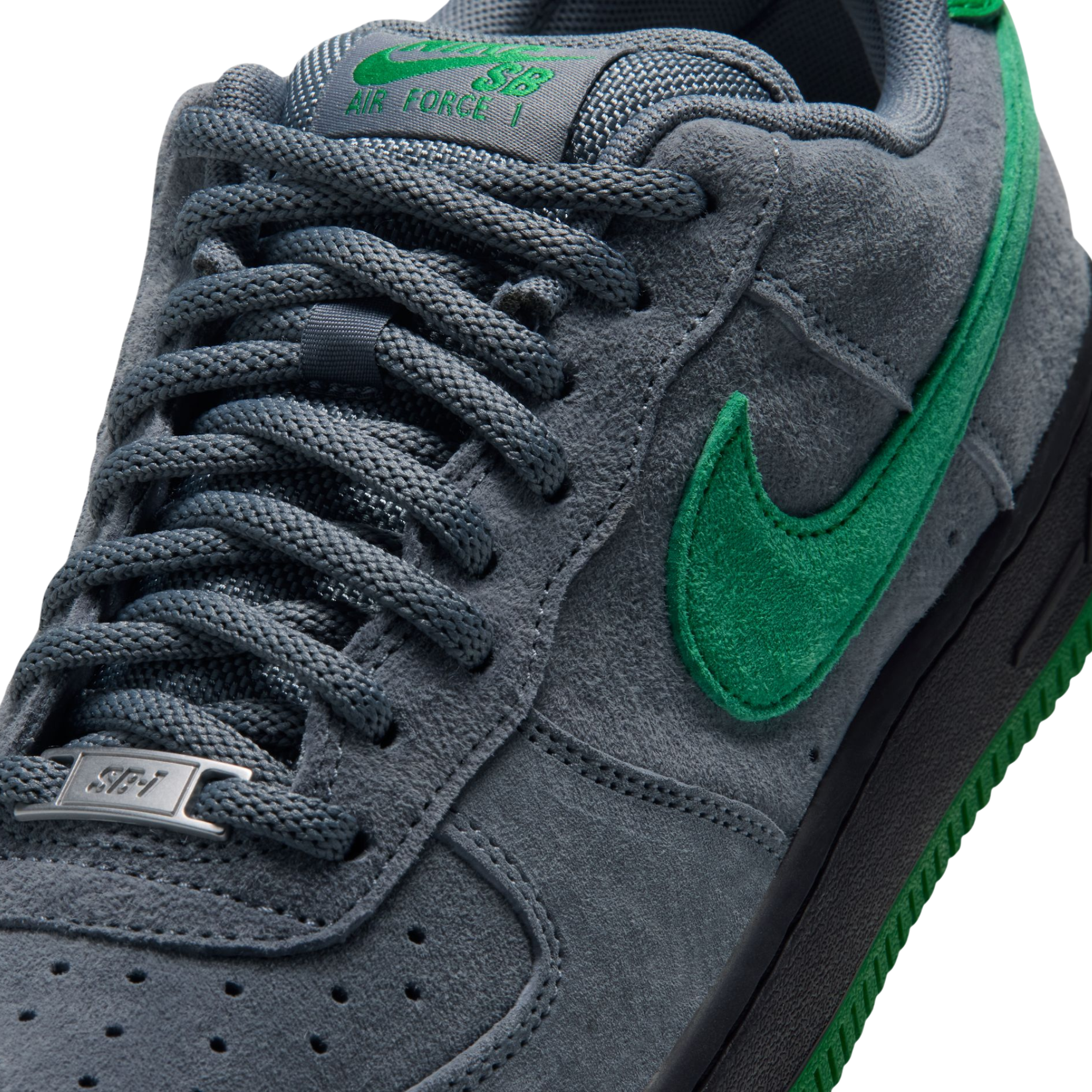grey nike sb x nocturnal air force 1 with green swoosh and black and green sole on a white background