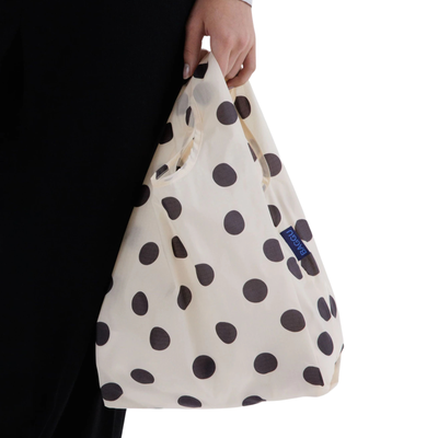 cream baby baggu reusable tote bag with black polka dots on a white background