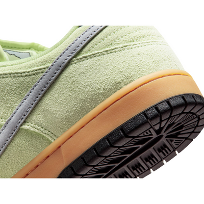Light green nike sb verdugo mountains nike sb dunk low sneaker with a gray swoosh logo on a white background