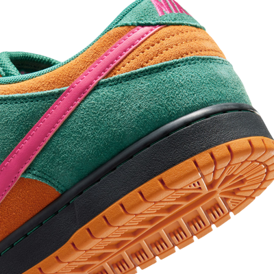 A low-top Nike sb dunk low watermelon sneaker in a vibrant multicolor palette, featuring teal green suede, orange suede overlays, a bright pink Swoosh and laces, and a black and orange sole, shown against a plain white background.