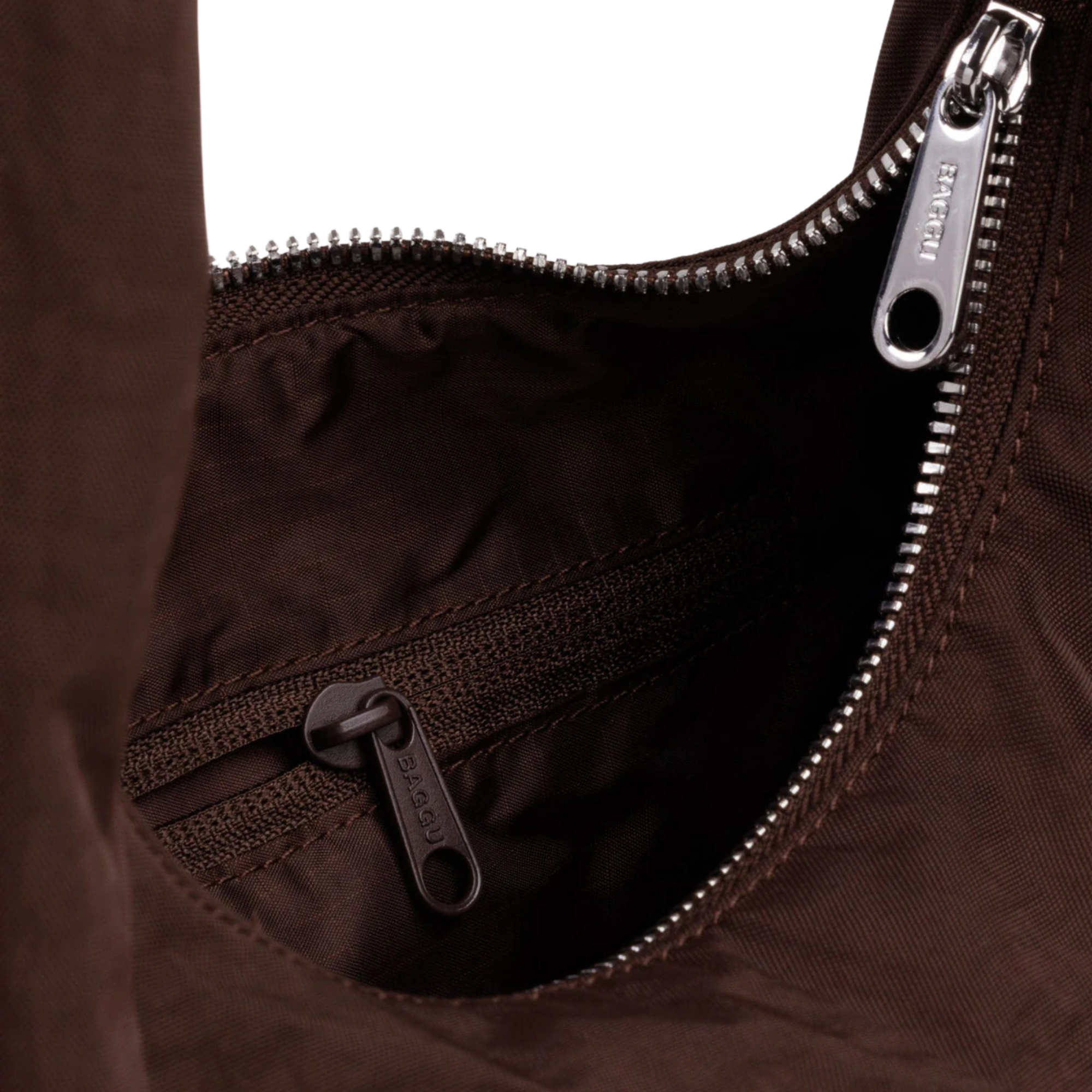 Close-up of A dark brown slouchy baggu meringue shoulder bag with a single strap, shown against a plain white background.
