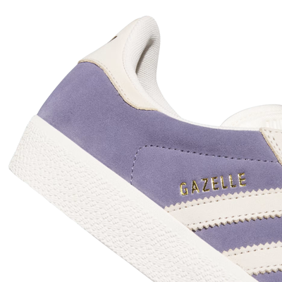 purple adidas gazelle adv skateboard shoe with white stripes on a white background