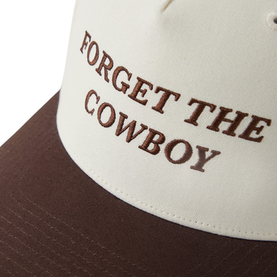 white and brown brixton hat with forget the cowboy in brown stitching