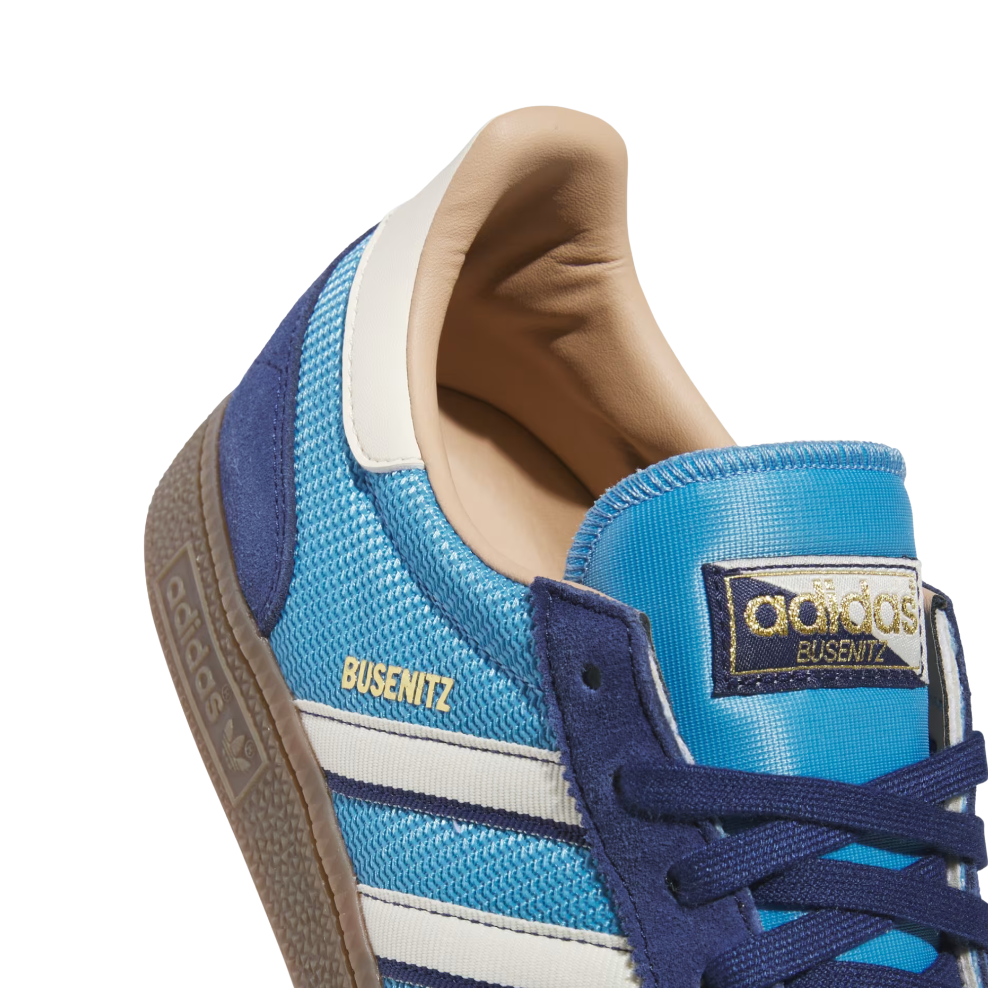 navy and bright blue adidas men's busenitz vintage skateboard shoes with white stripes and a gum sole on a white background