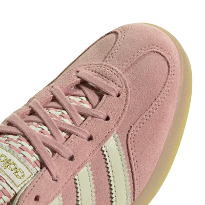 pink adidas women's gazelle indoor shoe with knit tongue and white stripes on a white background