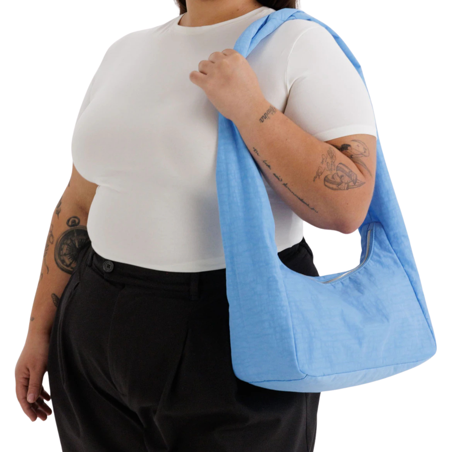 Light blue baggu nylon meringue shoulder bag on a white background
