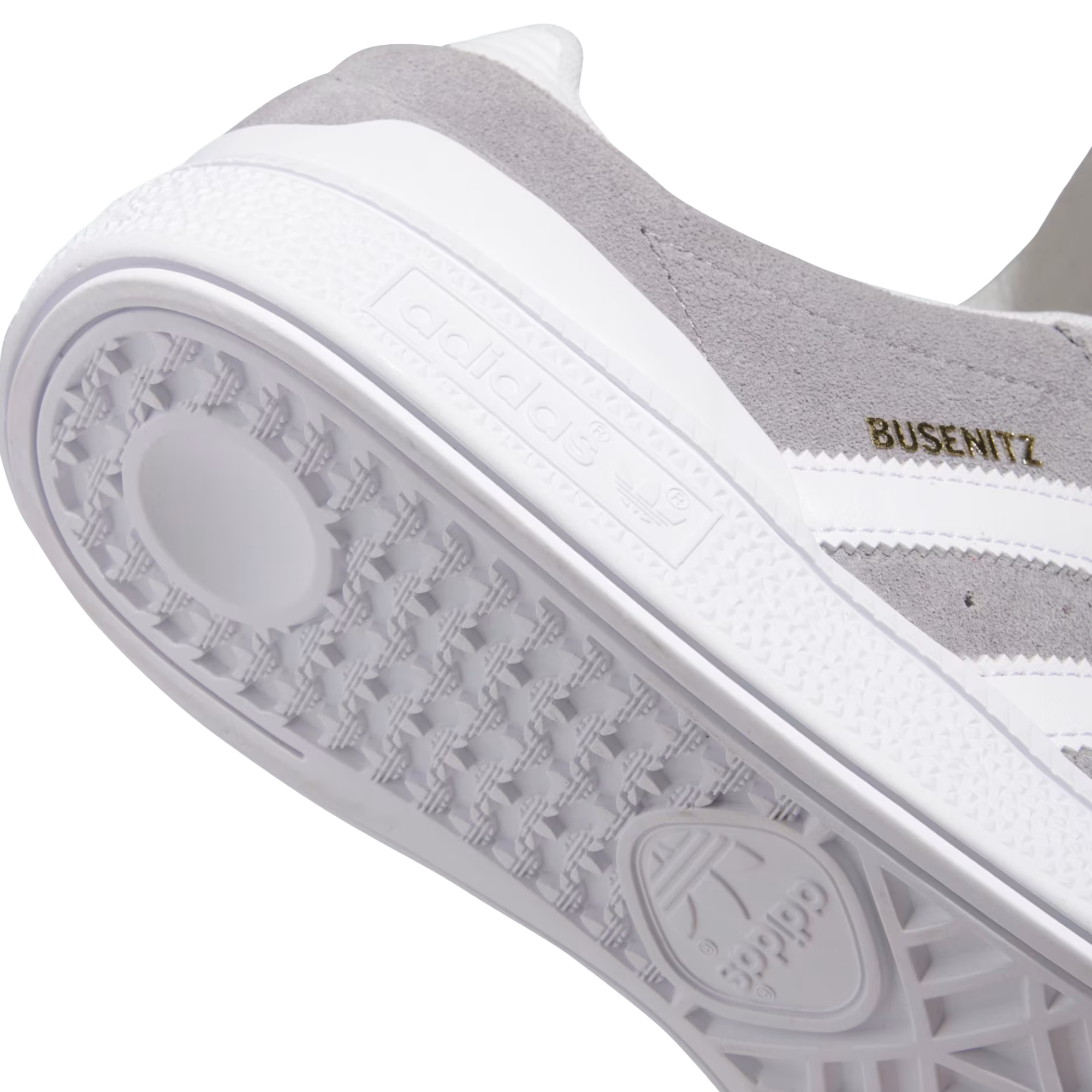 Gray Adidas busenitz skateboard sneaker with white stripes on a white background