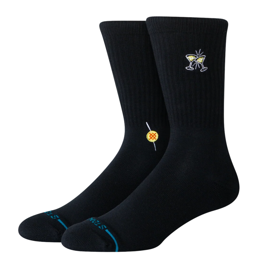 black stance combed cotton crew sock featuring 2 clinking martini glasses and a yellow and red stance logo on a white background