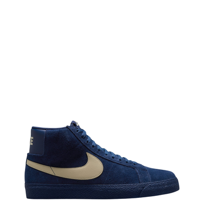 A high-top Nike sb Blazer skateboard sneaker in navy blue suede with a beige Swoosh logo and matching navy laces, shown from a side profile on a white background.