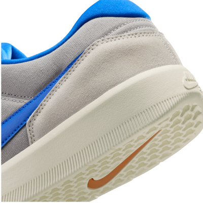 Blue and gray nike sb force 58 sneaker on a white background