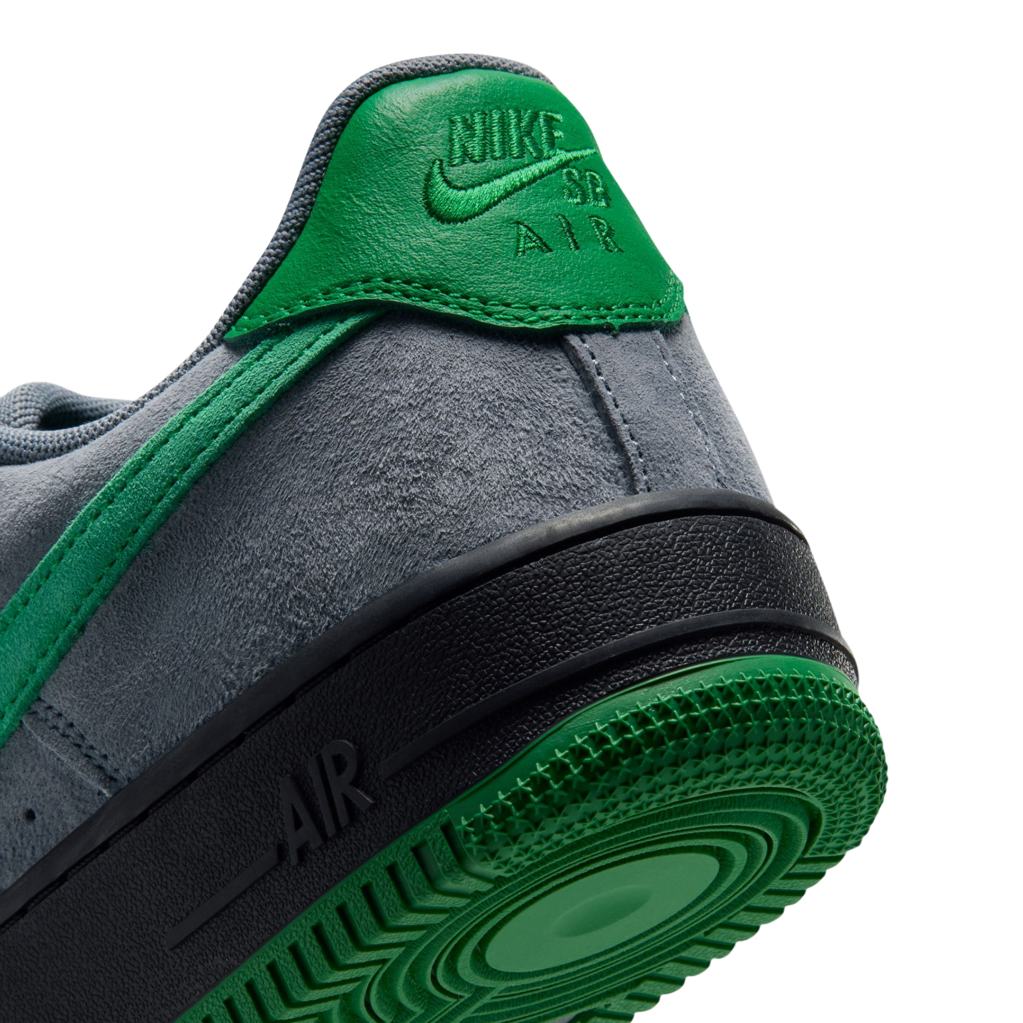 grey nike sb x nocturnal air force 1 with green swoosh and black and green sole on a white background