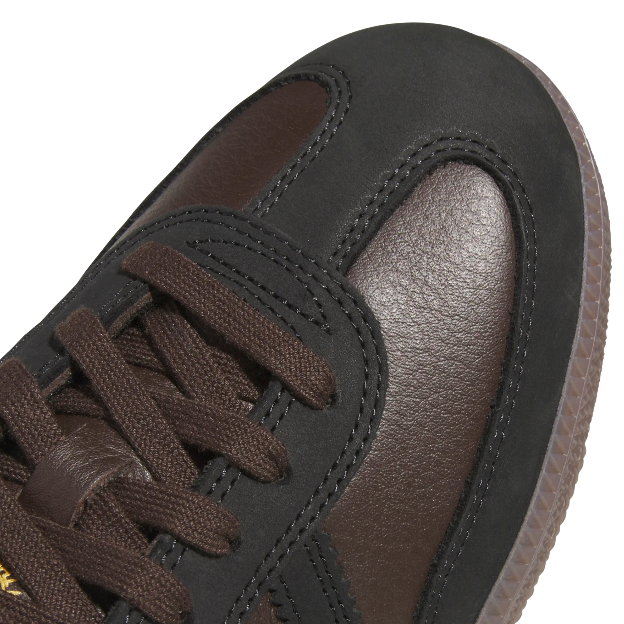 brown leather and suede men's adidas skateboarding adv sneaker with gum sole on a white background