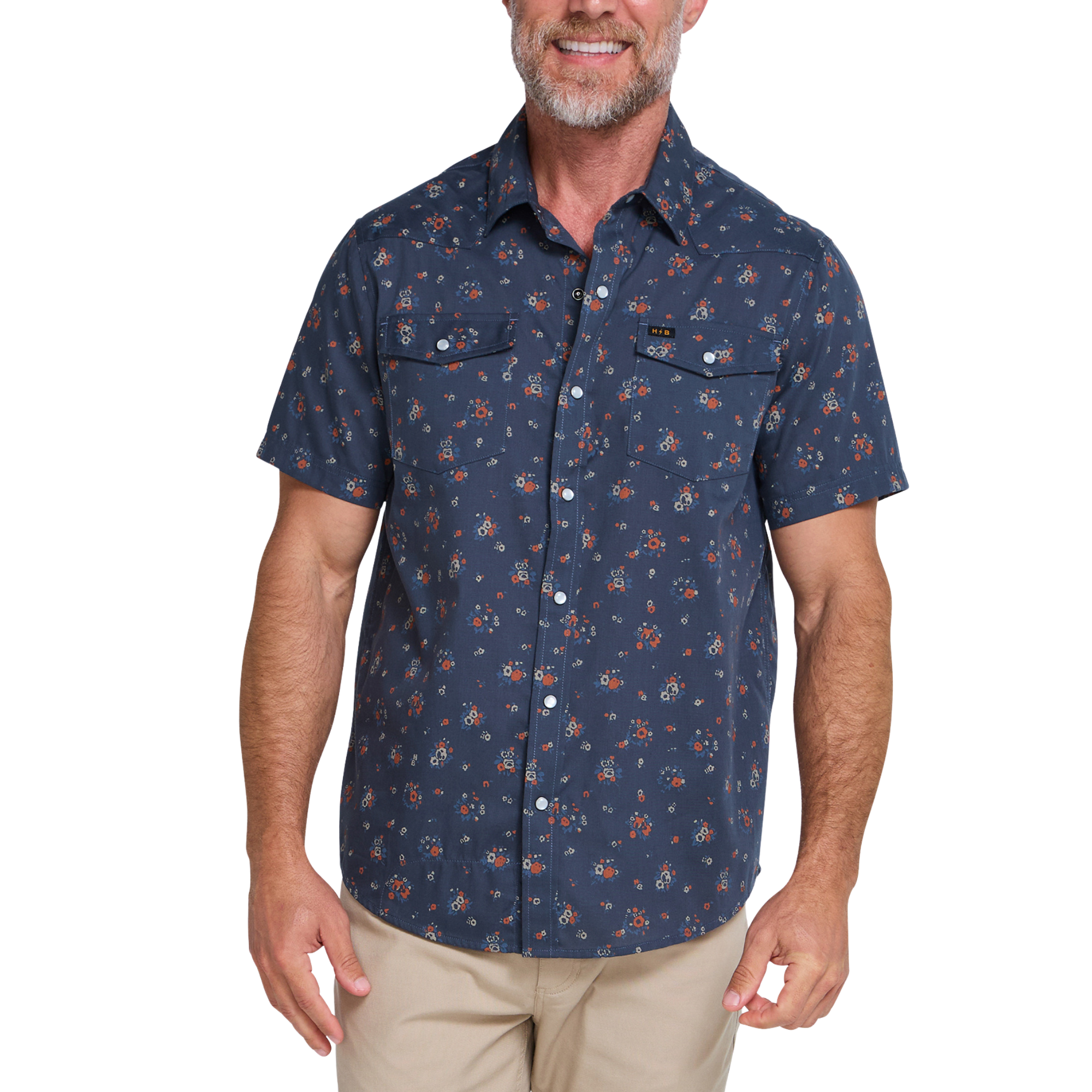 a man wearing a Holwer Brothers H Bar B Snapshirt Bouquets in a midnight blue wiht small all-over floral print on a white background