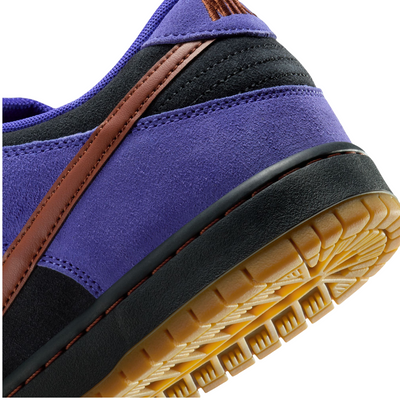Purple nike sb dunk low sneaker with dark red and black accents on a white background