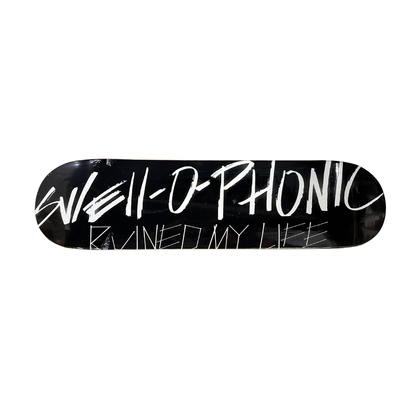 Black skateboard deck with SWELL-O-PHONIC ruined my life in white text on a white background