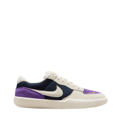 nike sb women's force 58 Sneaker with purple and navy accents on a white background