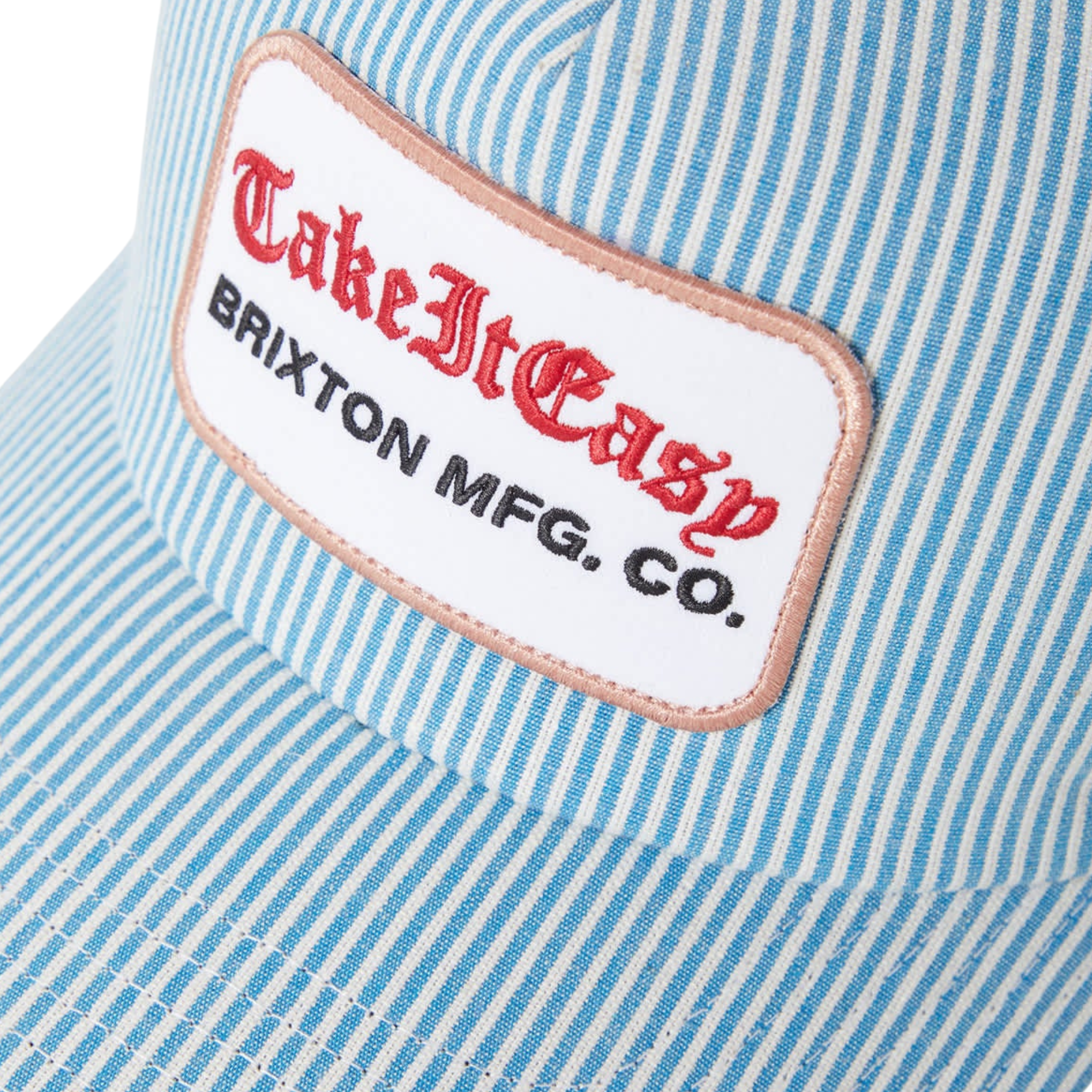 Blue and white striped brixton take it easy trucker hat with a patch on a white background