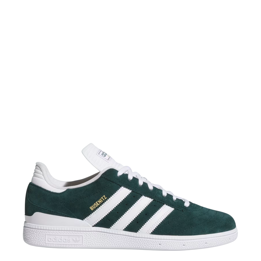 Green and white adidas busentiz skateboard sneaker with three white stripes on a light gray background
