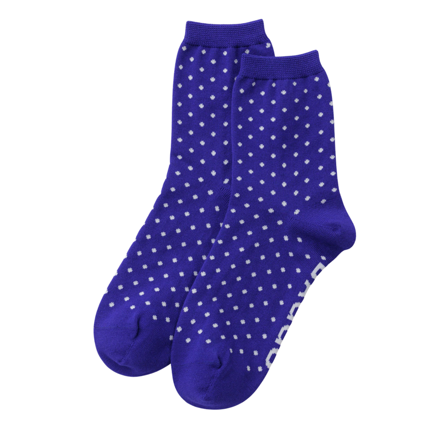 A pair of royal blue baggu crew socks with a white polka dot pattern, shown against a plain white background.