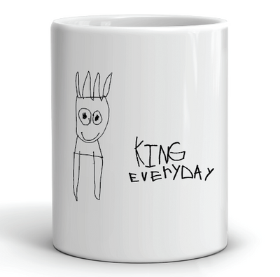 white ceramic coffee mug with cartoon design and king everyday in black font