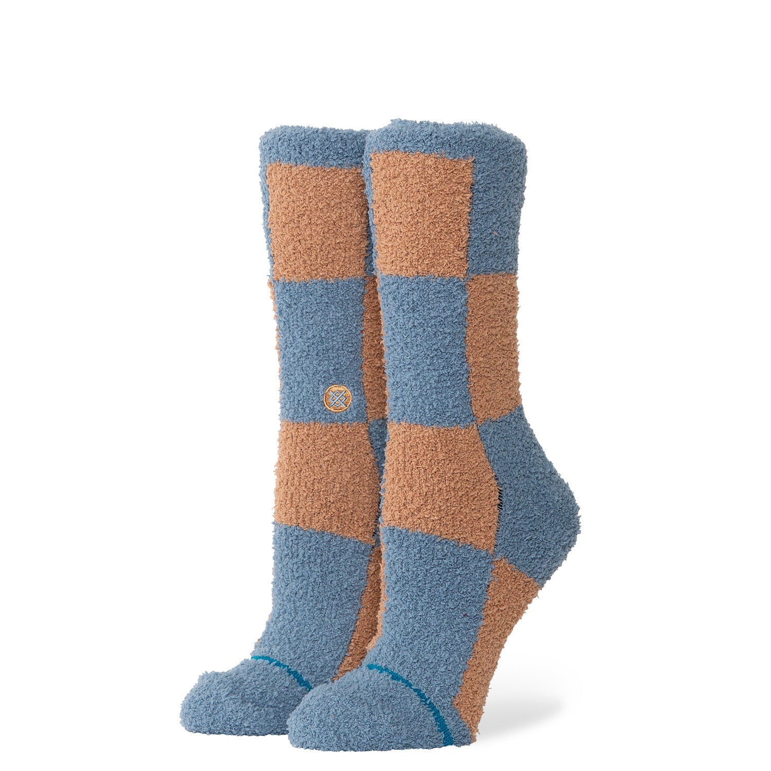 Pair of checkered stance patchwork cozy socks with blue and orange squares on a white background
