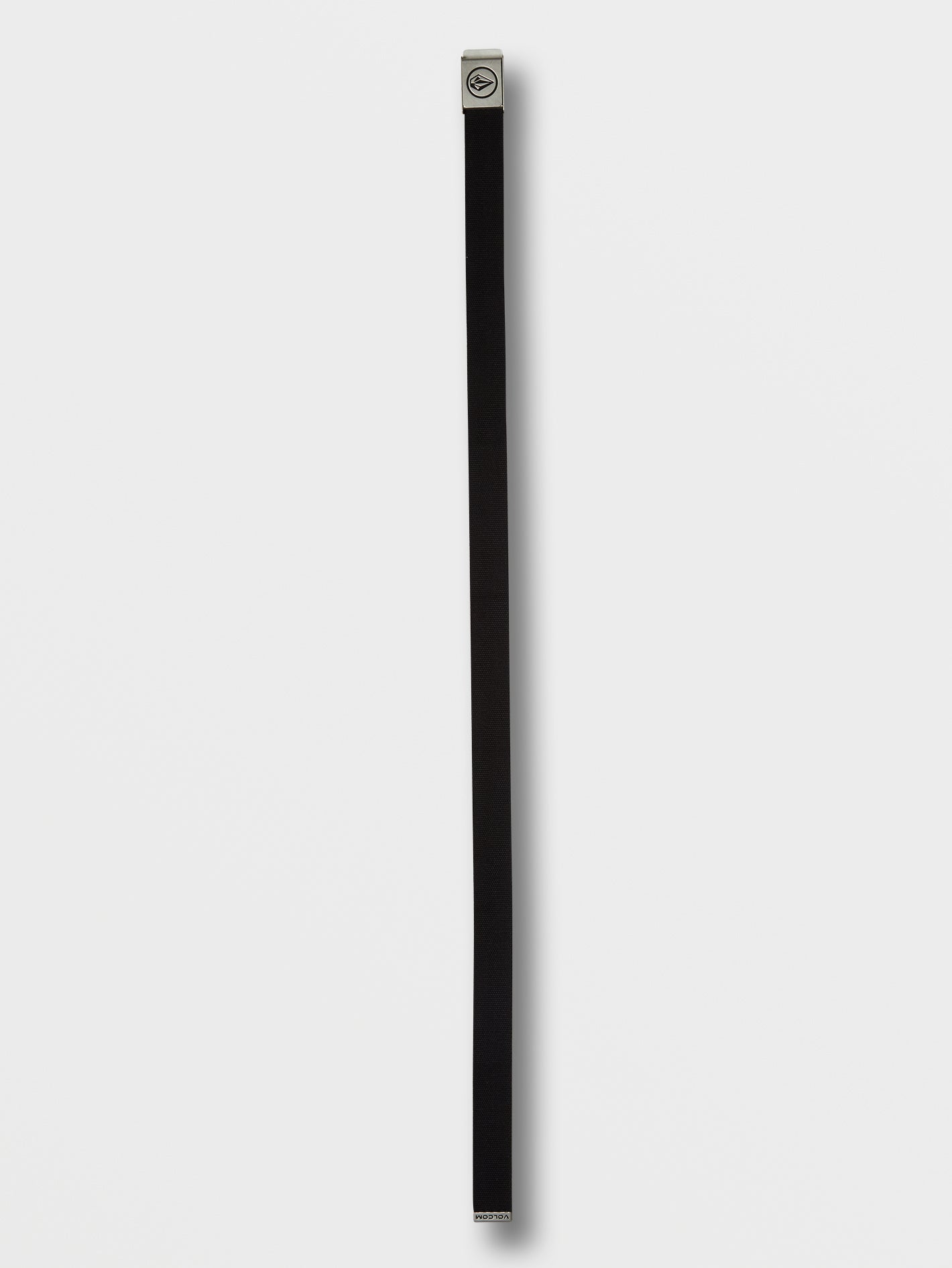 A black volcom circle woven web belt with a silver metal buckle featuring a circular black logo, coiled on a plain white background.