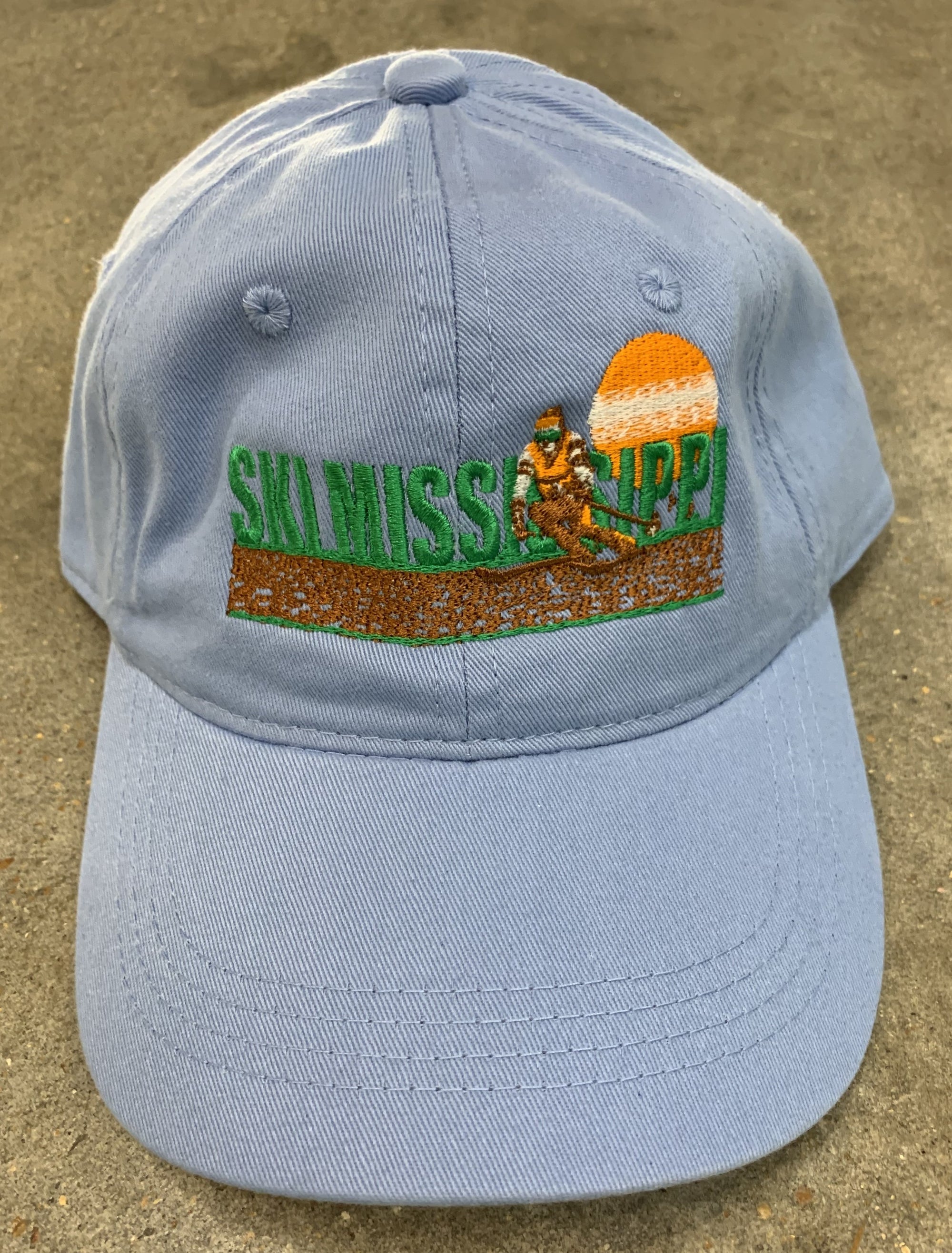 grey blue embroidered hat featuring the ski mississippi logo in green brown and orange