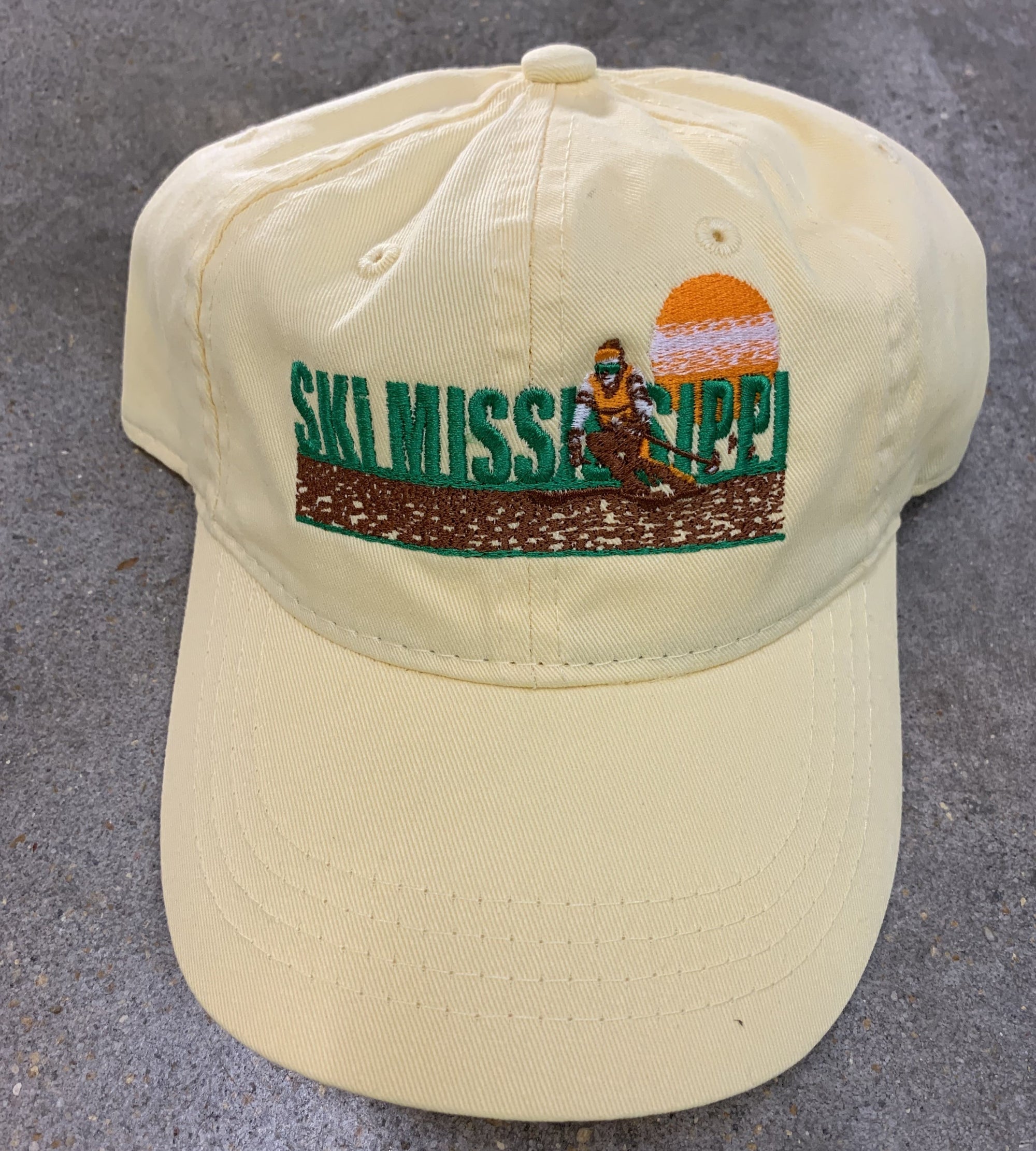 yellow embroidered hat featuring the ski mississippi logo in green brown and orange