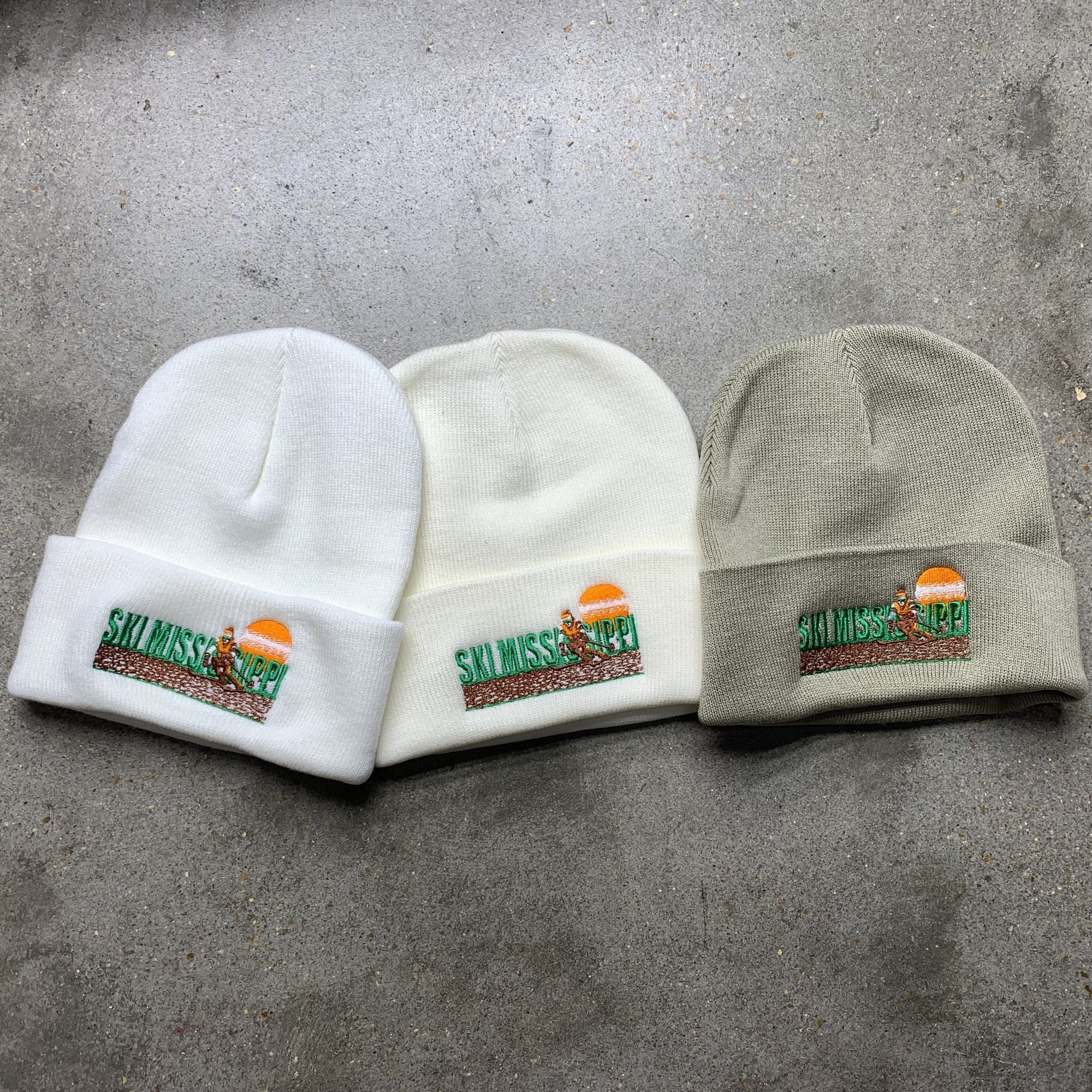 beanie knit cap featuring the ski mississippi logo in green brown and orange