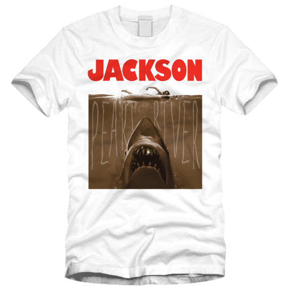 tee shirt featuring the jaws shark with a gold tooth in the pearl river