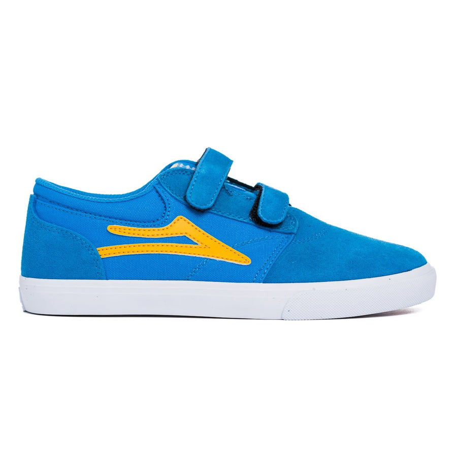 blue lakai kid's skate shoe with velcro straps, yellow logo and a white sole