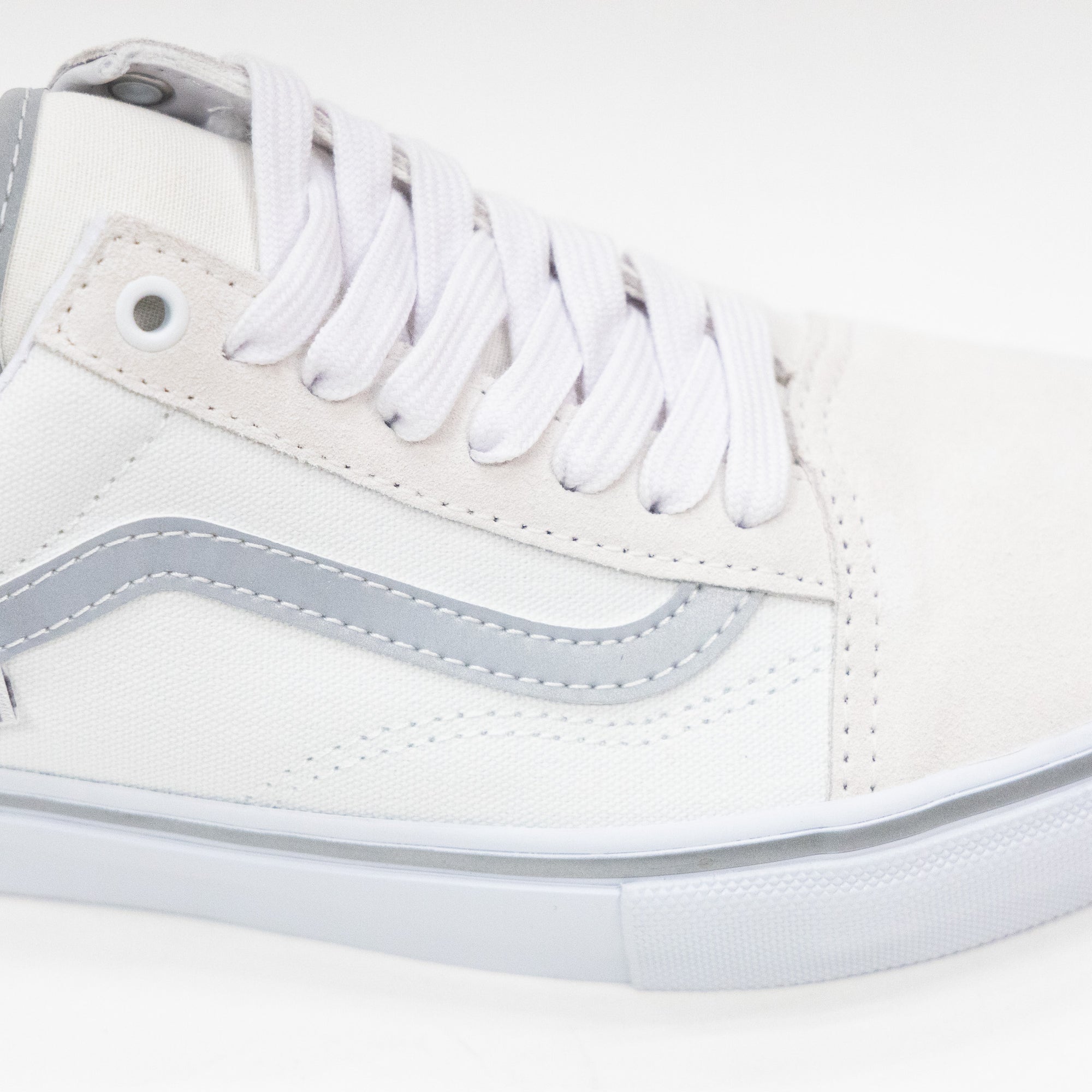 white women's old skool with reflective silver sidestripe and white sole