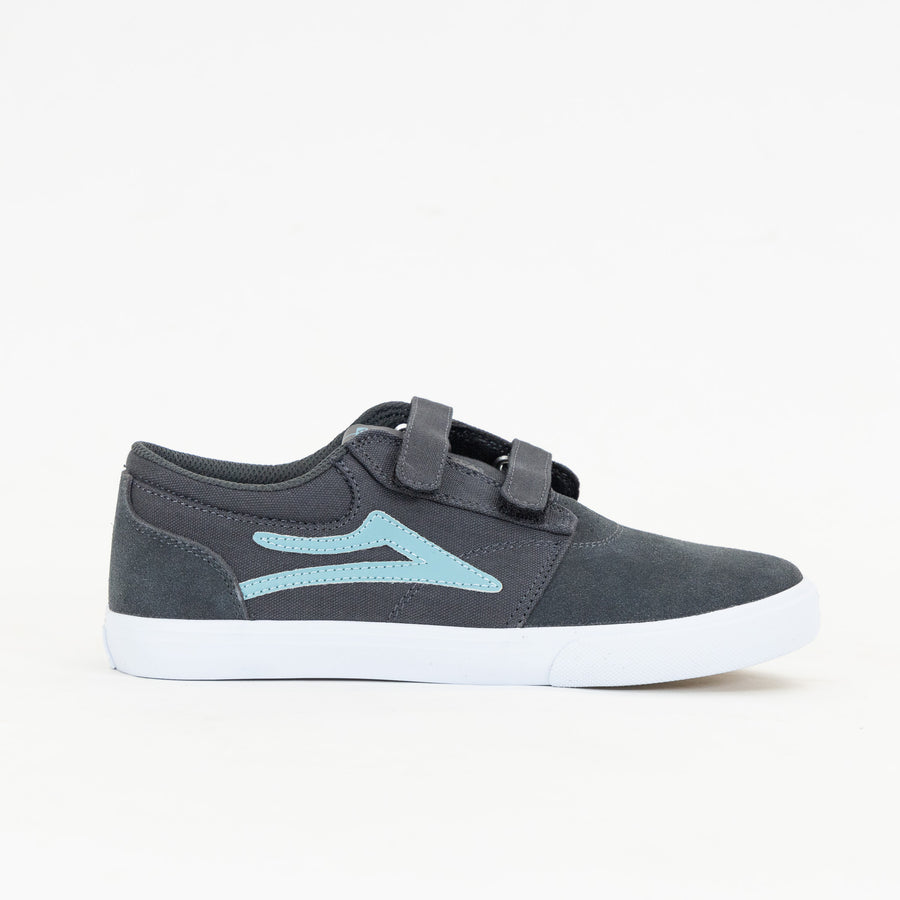 grey lakai kid's skate shoe with velcro straps, blue logo and a white sole